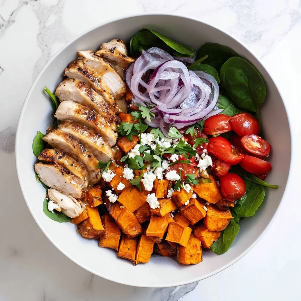 Juicy chicken with sweet maple glaze served over roasted sweet potatoes with tangy Dijon dressing