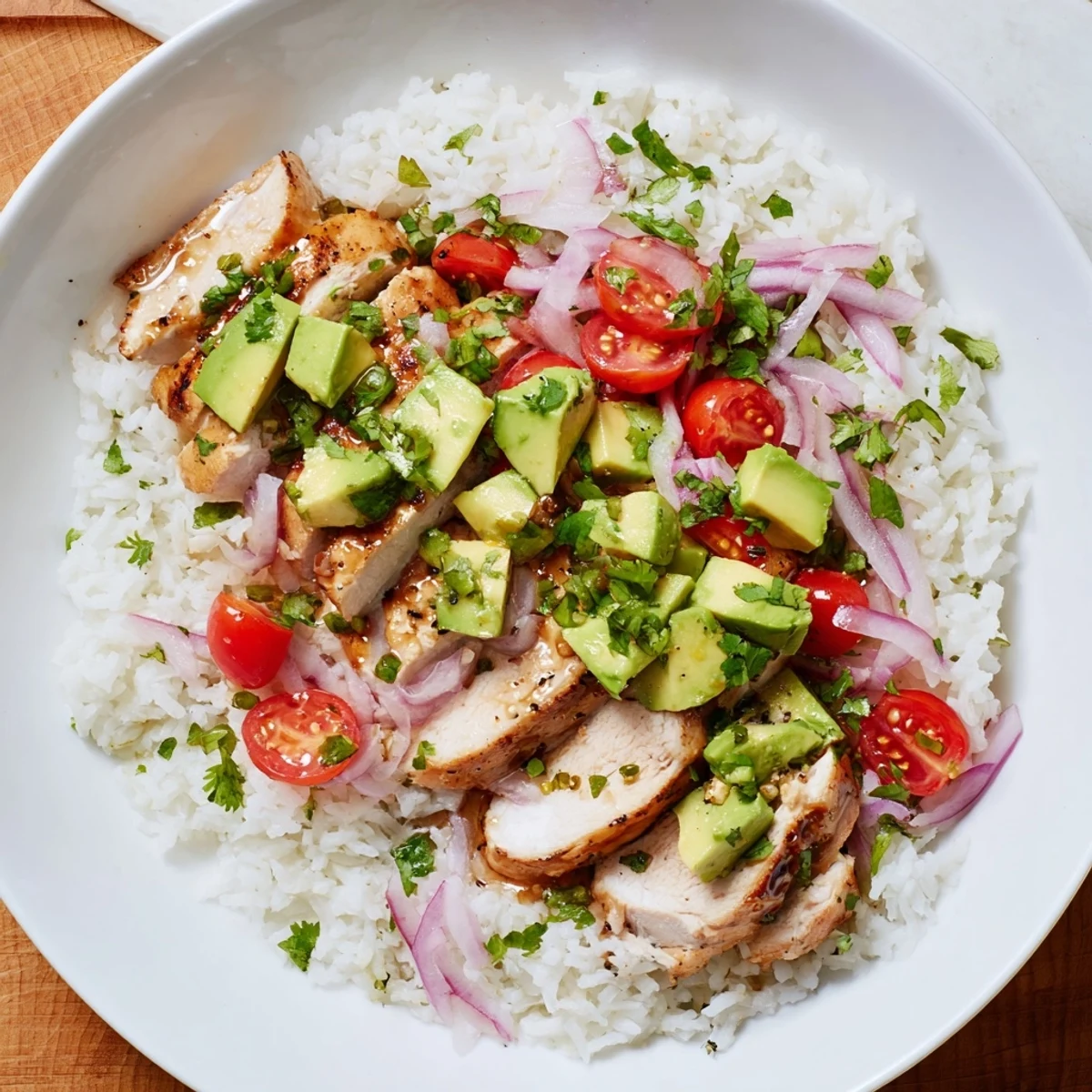 Vibrant honey lime chicken avocado rice stack featuring fluffy rice base topped with marinated grilled chicken breast