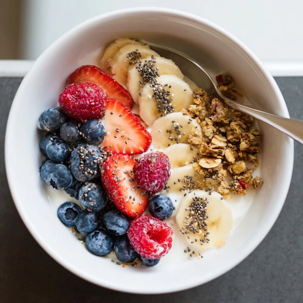 Protein-packed Cottage Cheese Breakfast Bowl served chilled with spoon, nutty chia seeds.