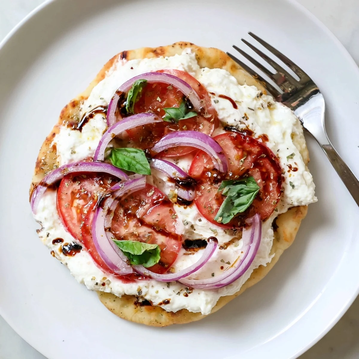 Caprese Pita Pizza With Whipped Garlic Feta on golden pita, balsamic drizzle