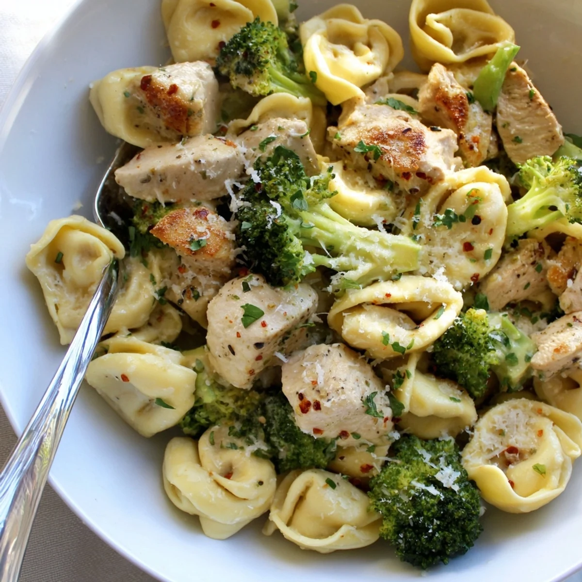 Creamy Garlic Parmesan Tortellini Chicken Broccoli Recipe skillet-tossed, aromatic garlic, cheese-sauced tortellini with chicken