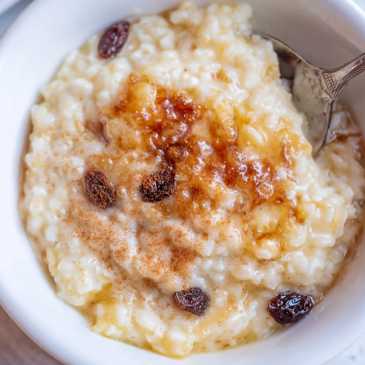 Warm, creamy Delicious Condensed Milk Baked Rice Pudding Recipe To Try with cinnamon