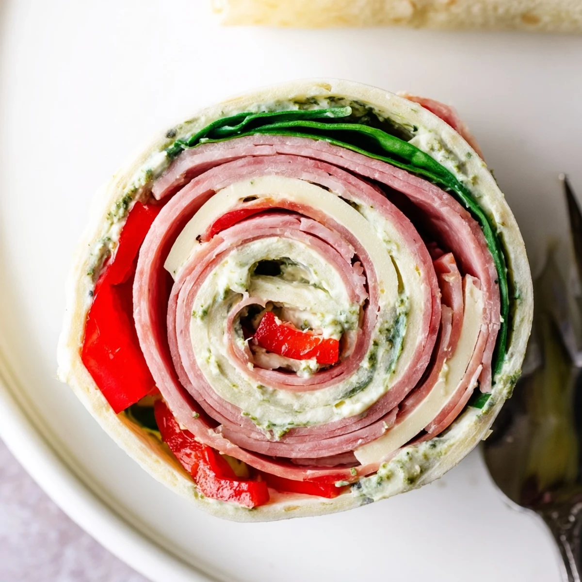 Party-ready Italian Pinwheel Sandwiches with savory salami, provolone, vibrant vegetables