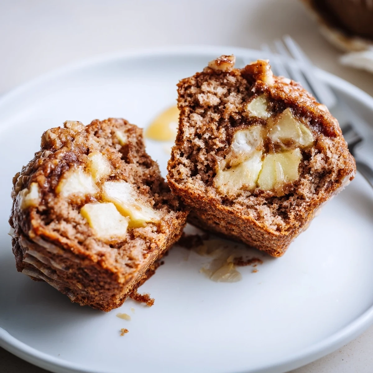Healthy Apple Cinnamon Greek Yogurt Muffins plated for breakfast beside coffee.