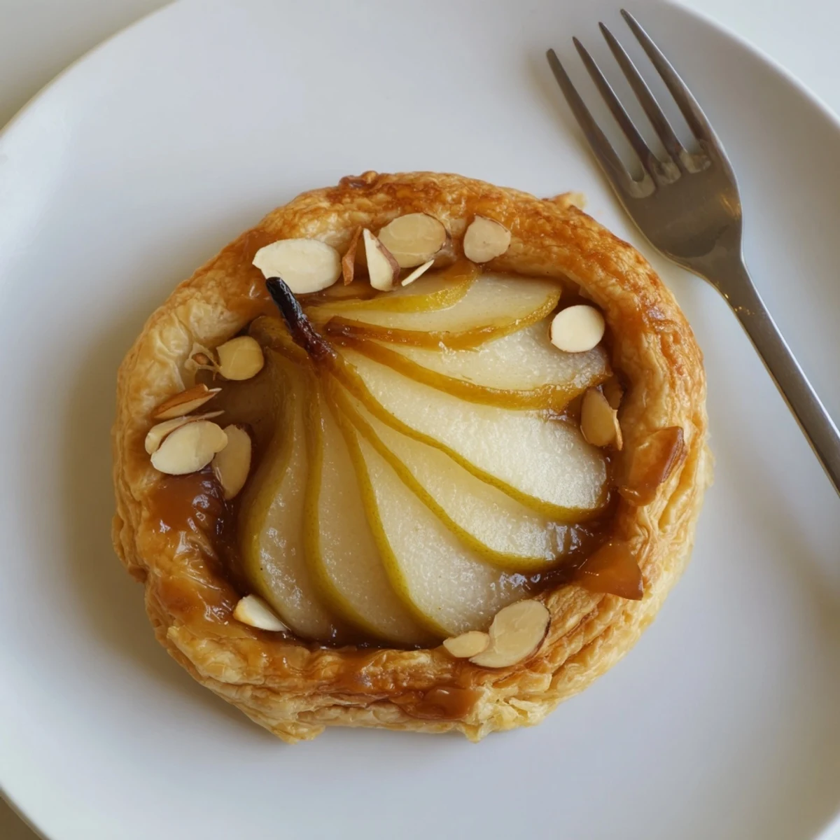 Pear Puff Pastry Recipe showing golden flaky pastries topped with glossy apricot glaze