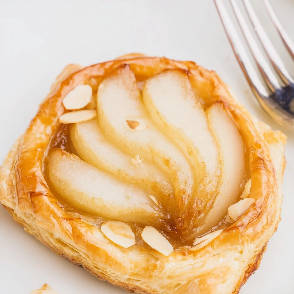 Rustic Pear Puff Pastry Recipe on parchment, tender pear slices and buttery edges