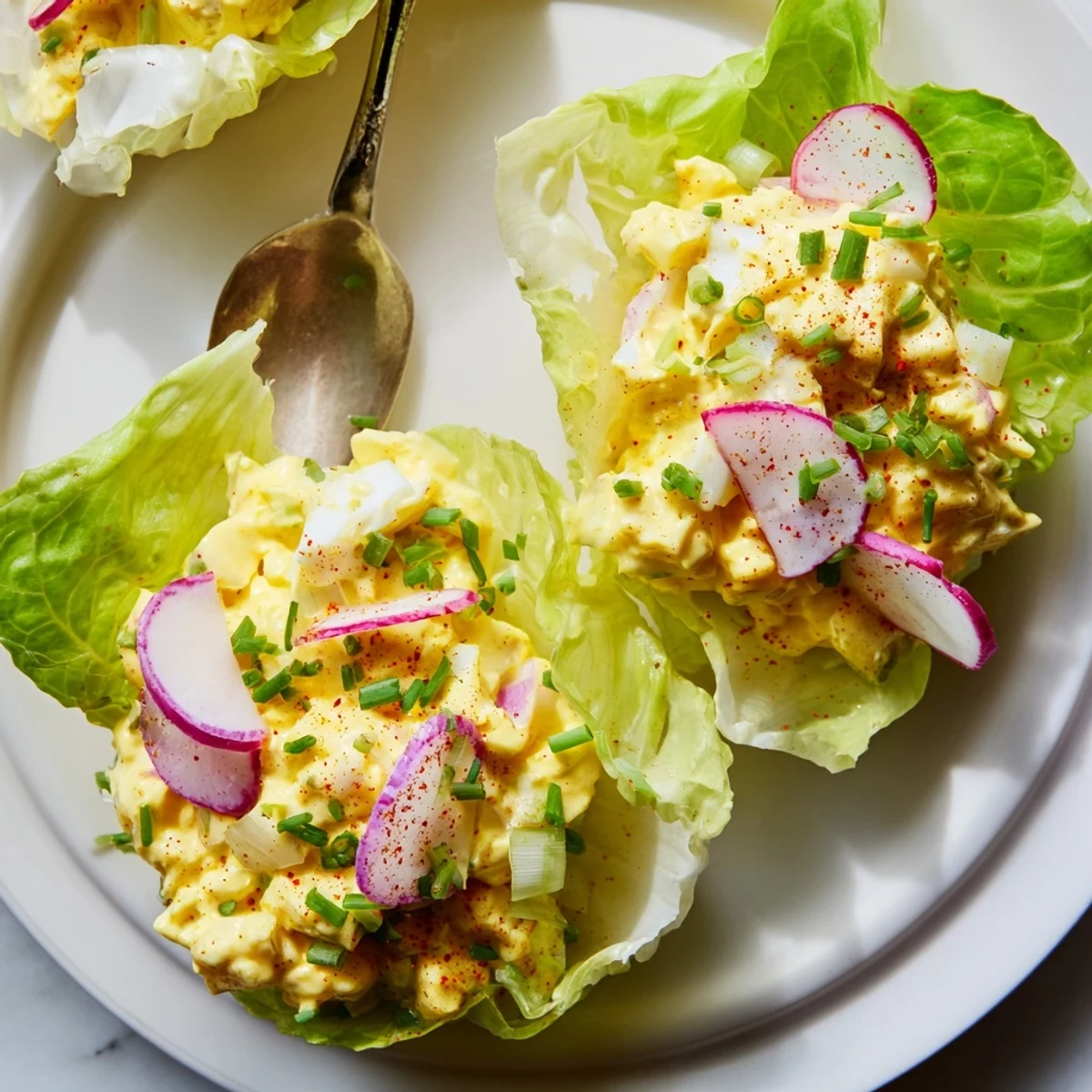 Easy Egg Salad Lettuce Wraps displayed individually, lemon zest and fresh chives