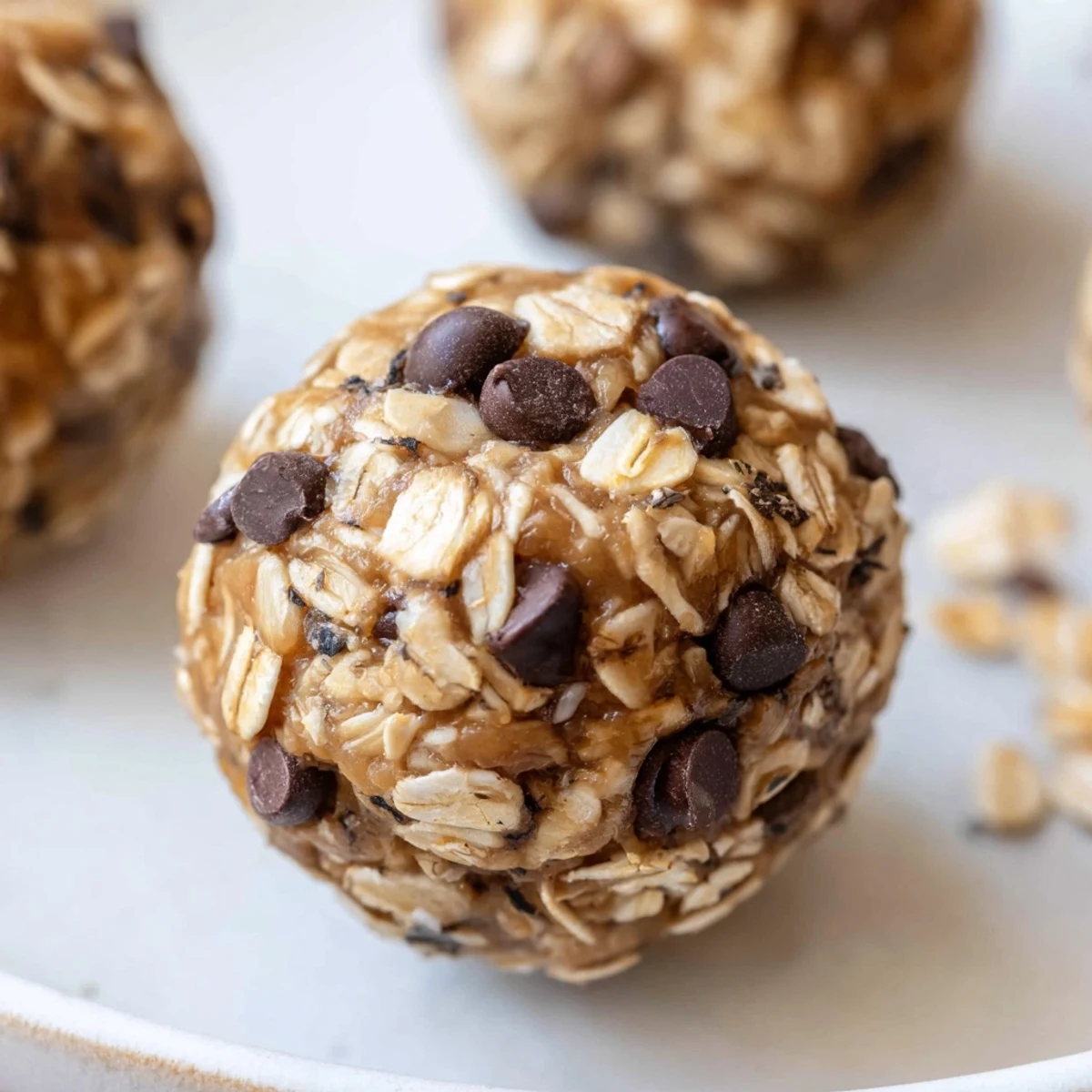 No Bake Energy Balls arranged on plate, chewy oats and chocolate aroma