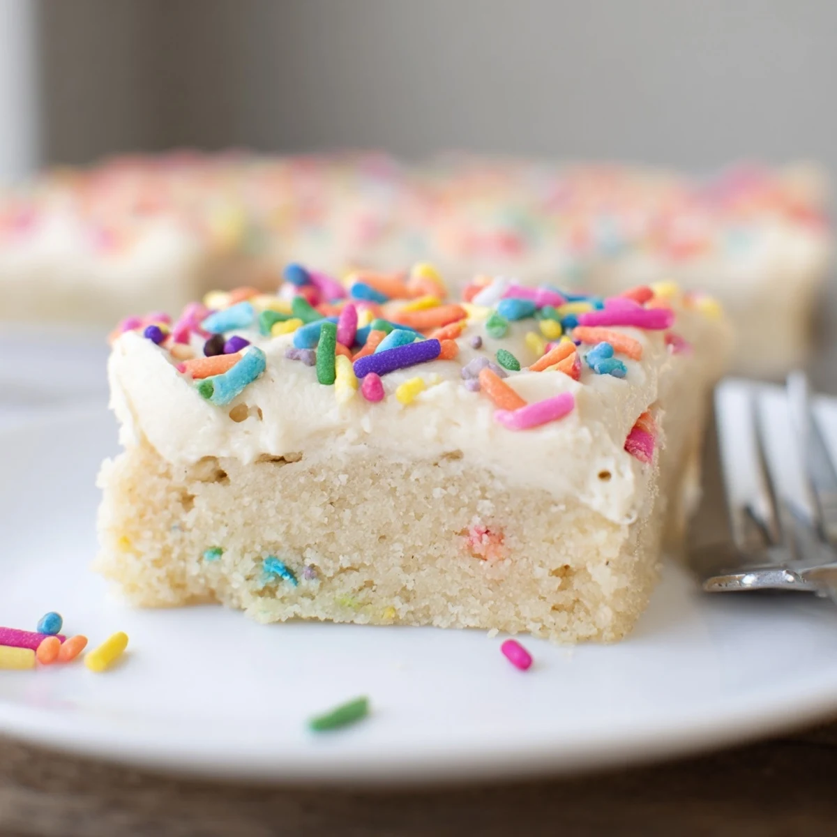 A platter of warm Frosted Sugar Cookie Bars Recipe served for parties, festive sweet
