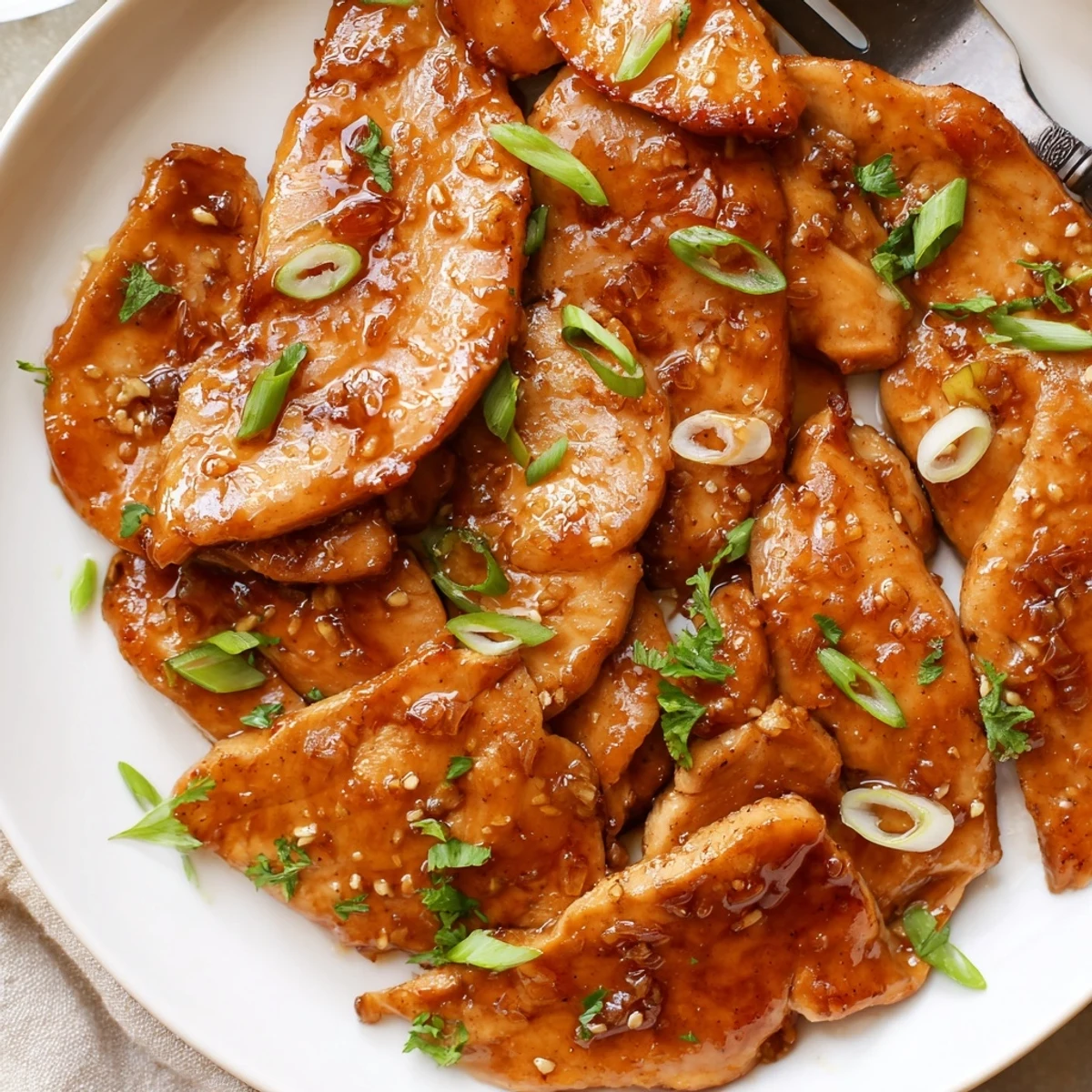 Fork-tender Slow Cooker Brown Sugar Garlic Chicken bathed in caramelized sweet garlic glaze.