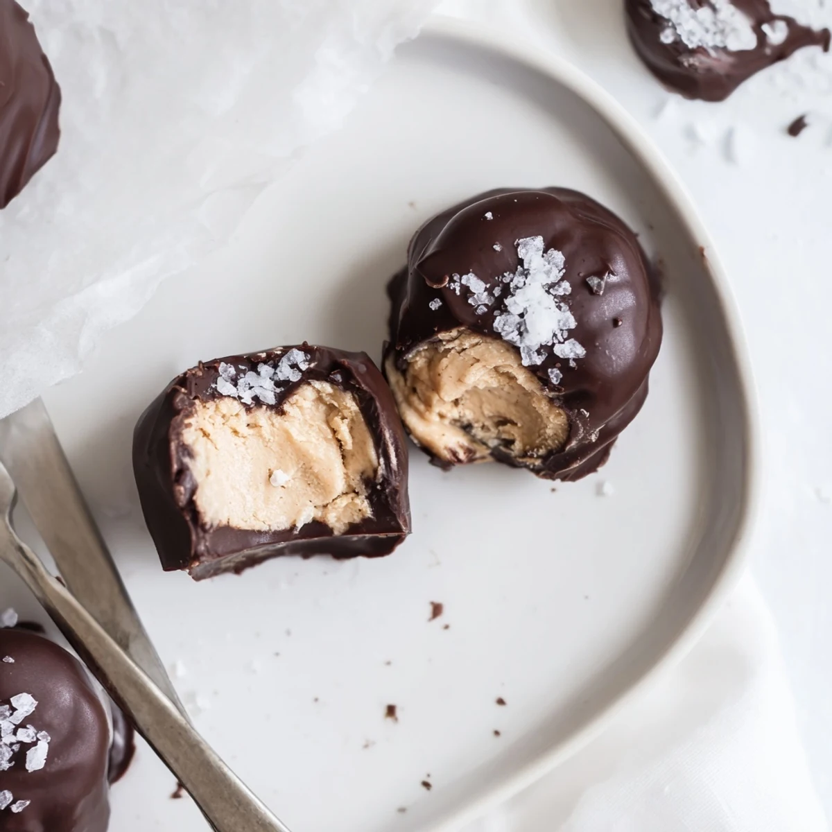 Creamy Frozen Peanut Butter Greek Yogurt Bites served frozen on parchment, ready to snack