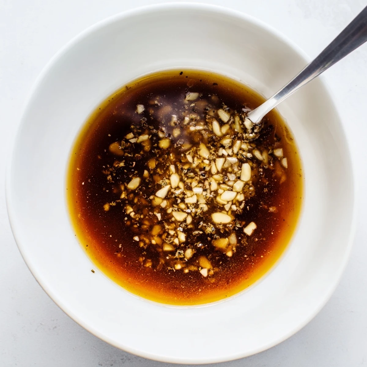 Silky Rich Garlic Sauce draped over roasted potatoes, garlicky aroma wafting.