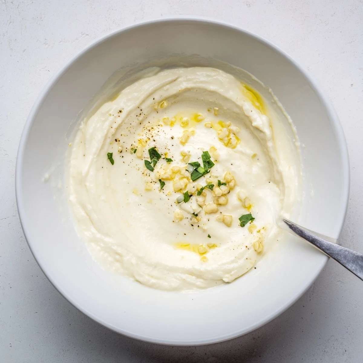 Creamy Rich Garlic Sauce thickened on stovetop, perfect for pasta.