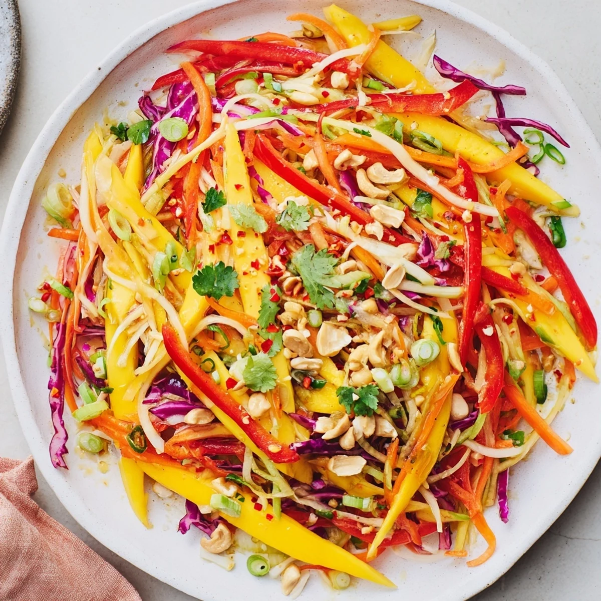 Serve this Mango Slaw Recipe chilled alongside grilled fish for contrast