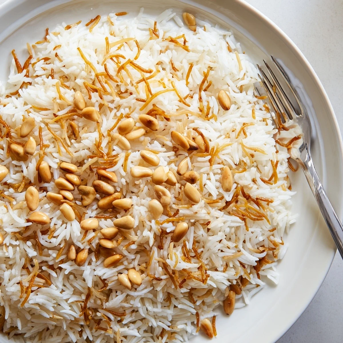 Fluffy Lebanese Rice with golden toasted vermicelli crowned with crunchy pine nuts