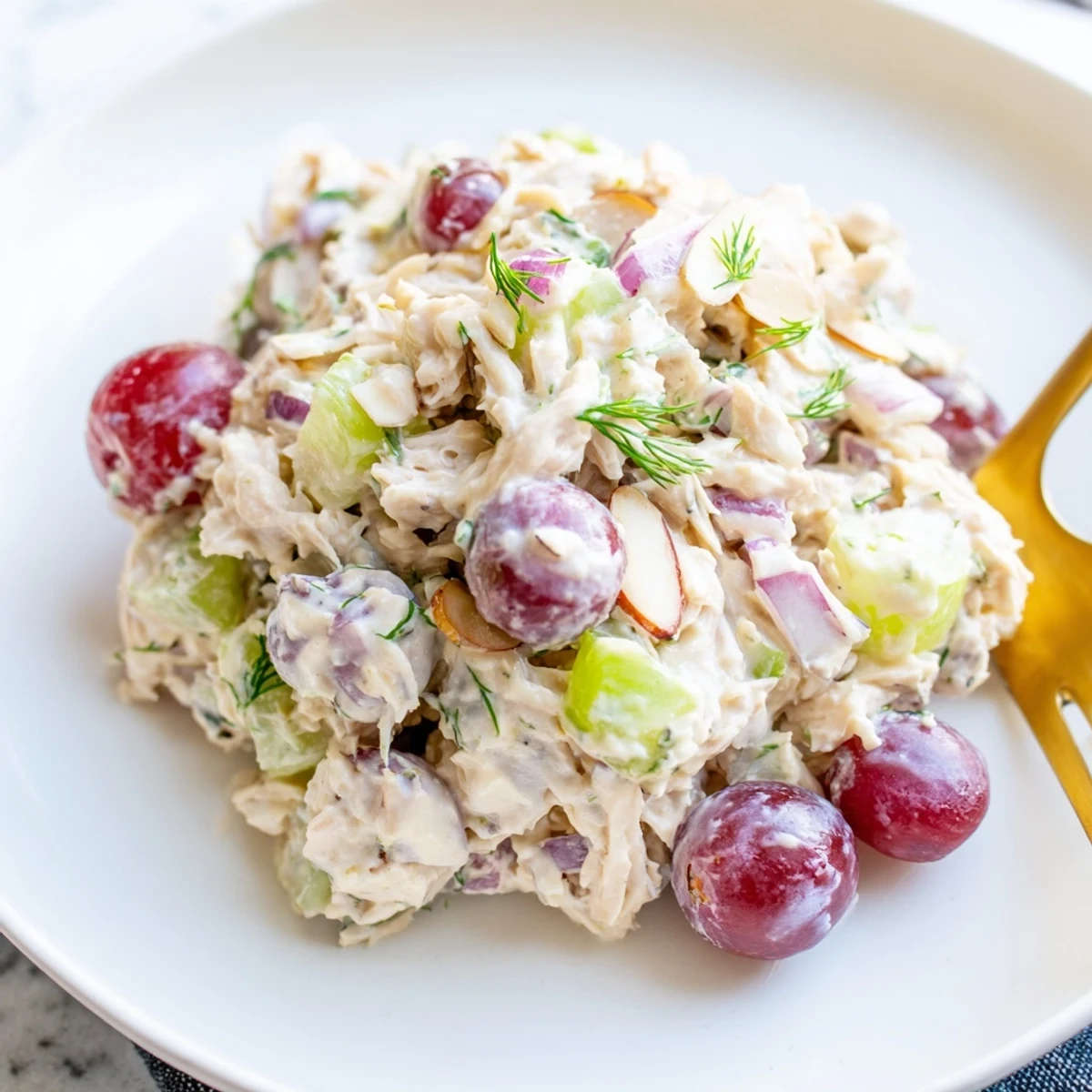 Vegan chicken salad in a bowl studded with crisp celery grapes and crunchy almonds