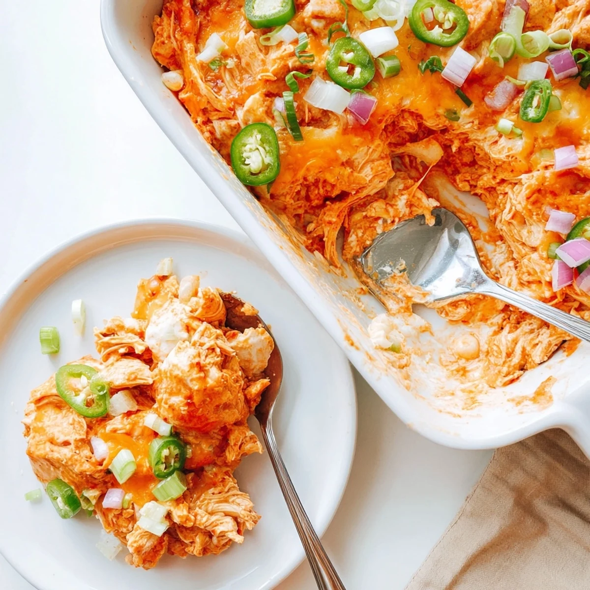 Spicy Jalapeno Buffalo Chicken Casserole served steaming in a rustic baking dish