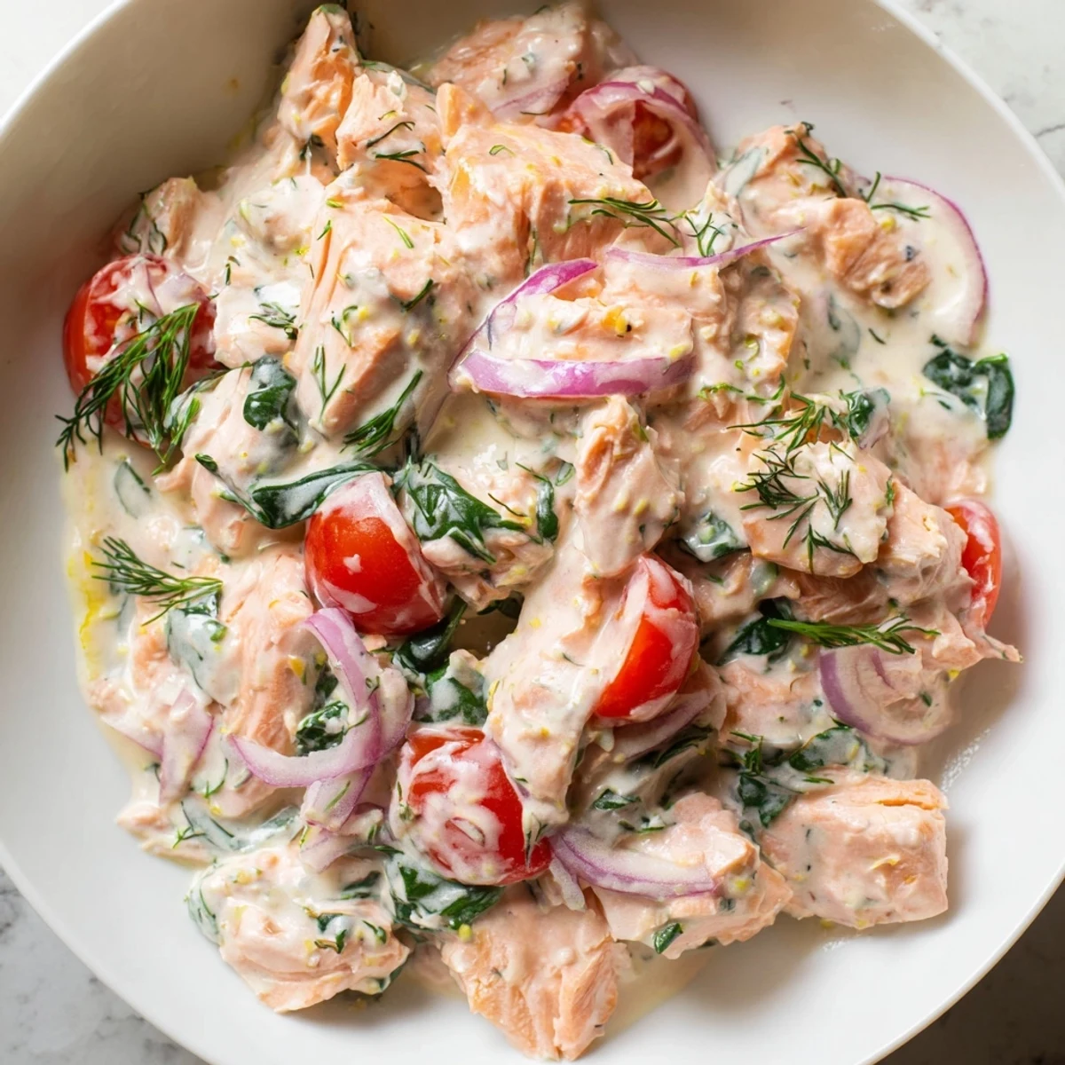 Golden creamy leftover salmon recipe topped with fresh dill and chives