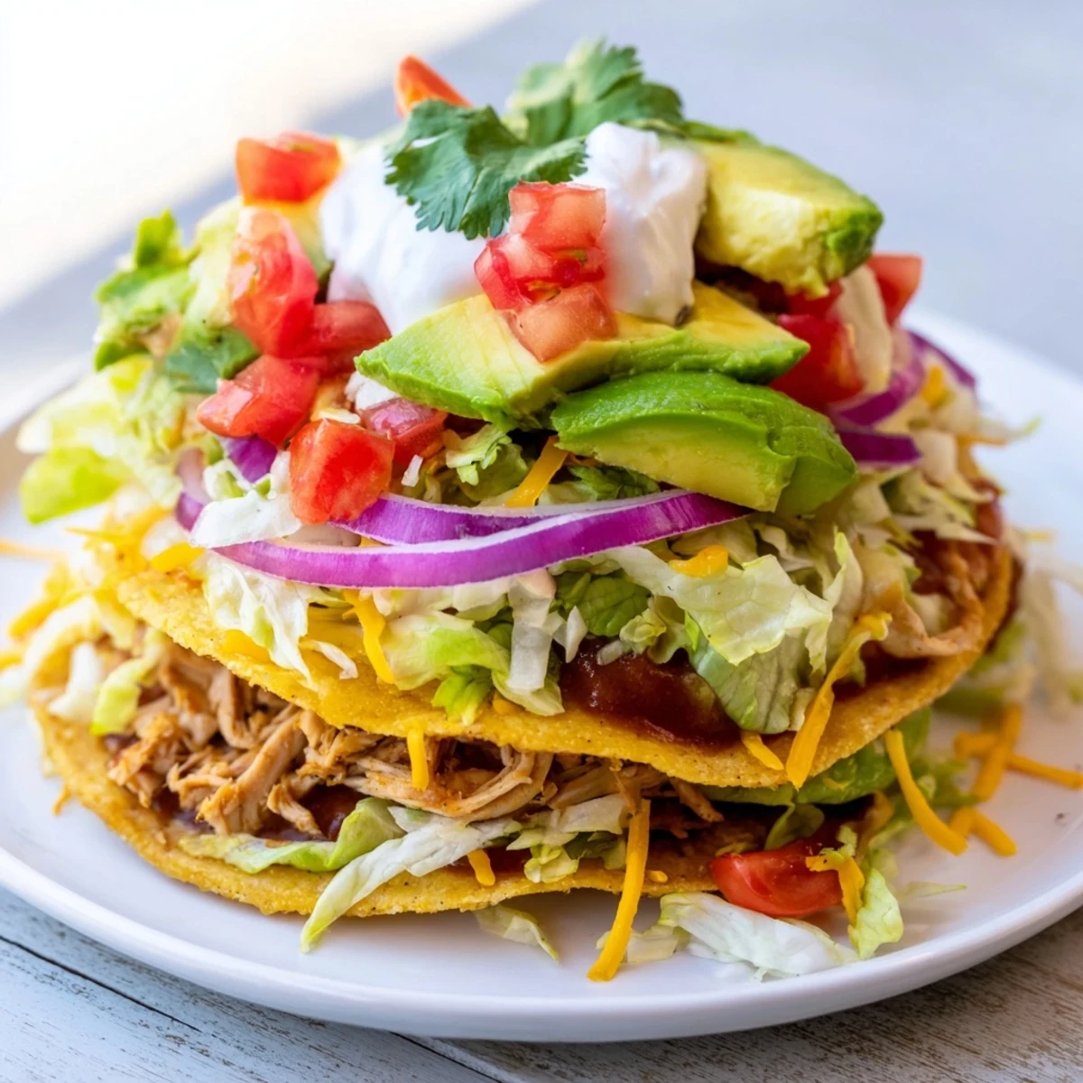 Ultimate chicken tostadas featuring crispy shells, juicy meat, and vibrant garnishes.
