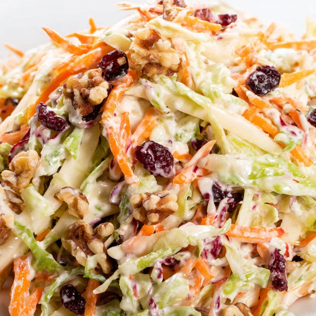 Crisp shredded cabbage and apples tossed with tangy cranberries for a refreshing side dish  