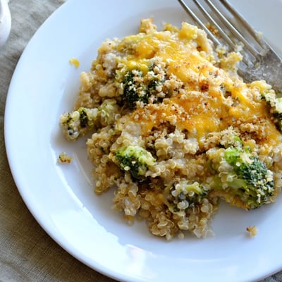 Vegetarian creamy broccoli quinoa casserole topped with crispy breadcrumbs fresh from the oven